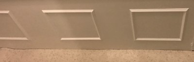 The false front on the bath surround. The right square is the false one with the magnetic closure.