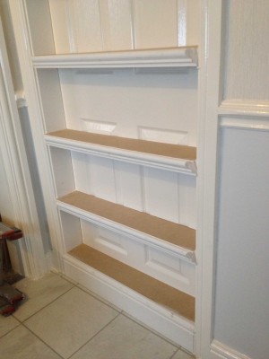 During construction with the bottom floating shelf